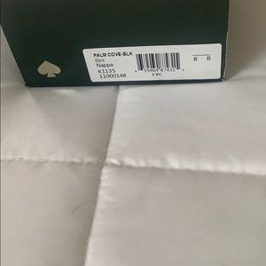 New black leather Kate Spade slides.